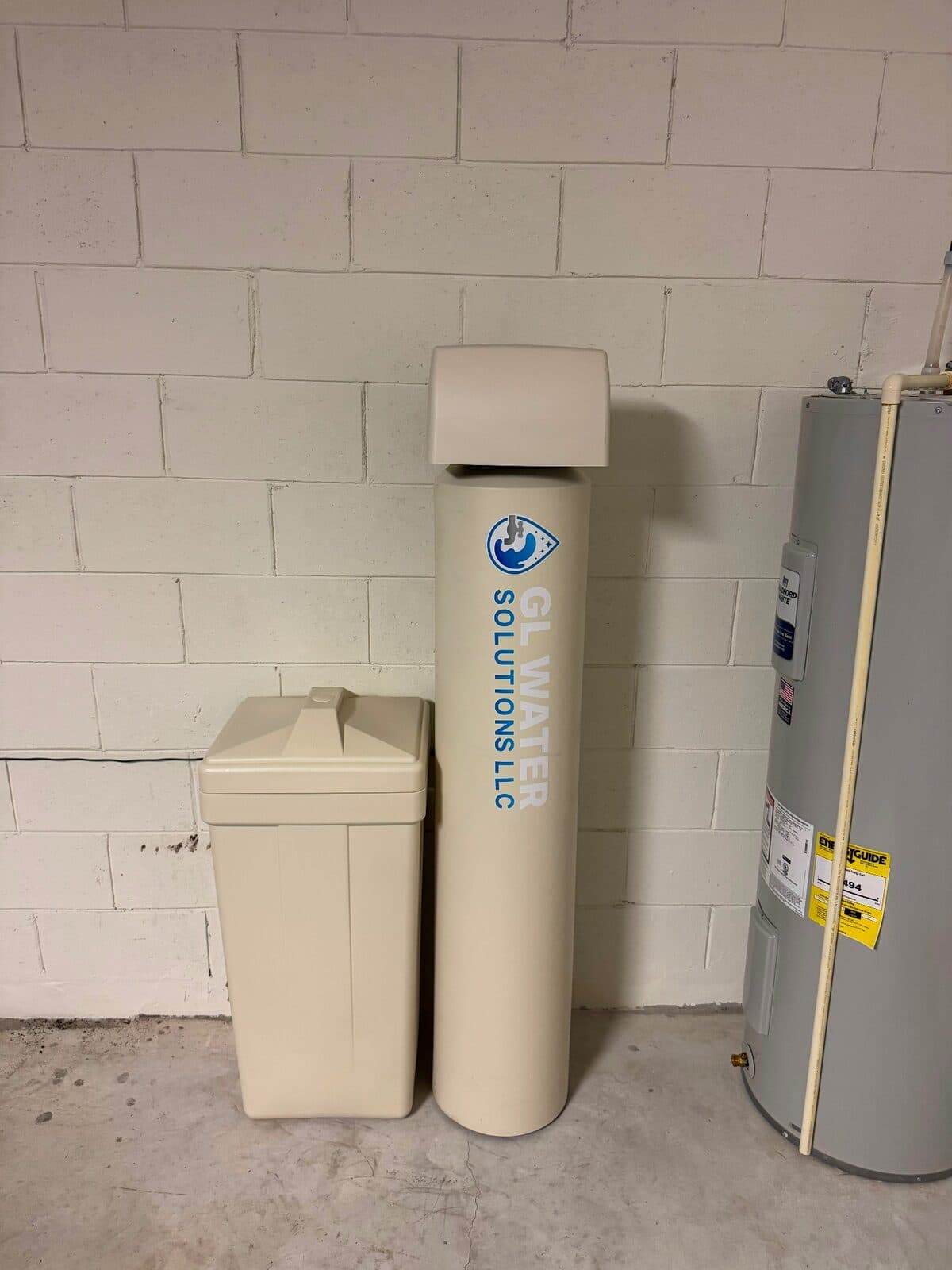 Filtration system installed next to a residential water heater