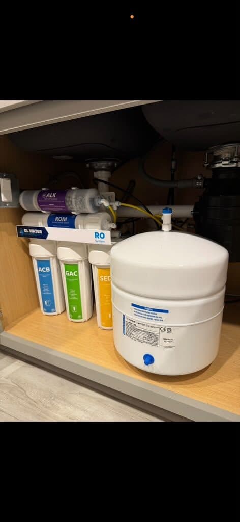 Reverse osmosis drinking-water system installed under a kitchen sink